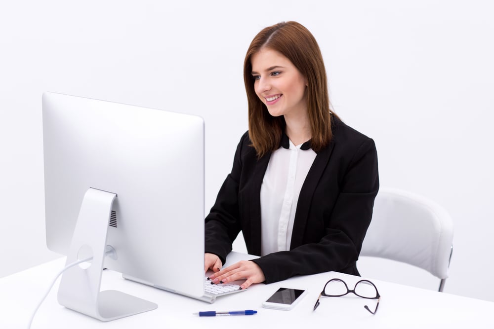 Portrait of a happy businesswoman working in the office